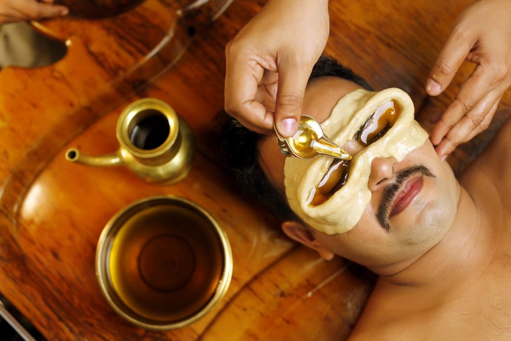 Ayurvedic eye therapy at Sai Ayush Ayurveda, KPHB, Hyderabad. A man receives a traditional treatment where herbal oil is applied over dough molds placed around his eyes for holistic healing.